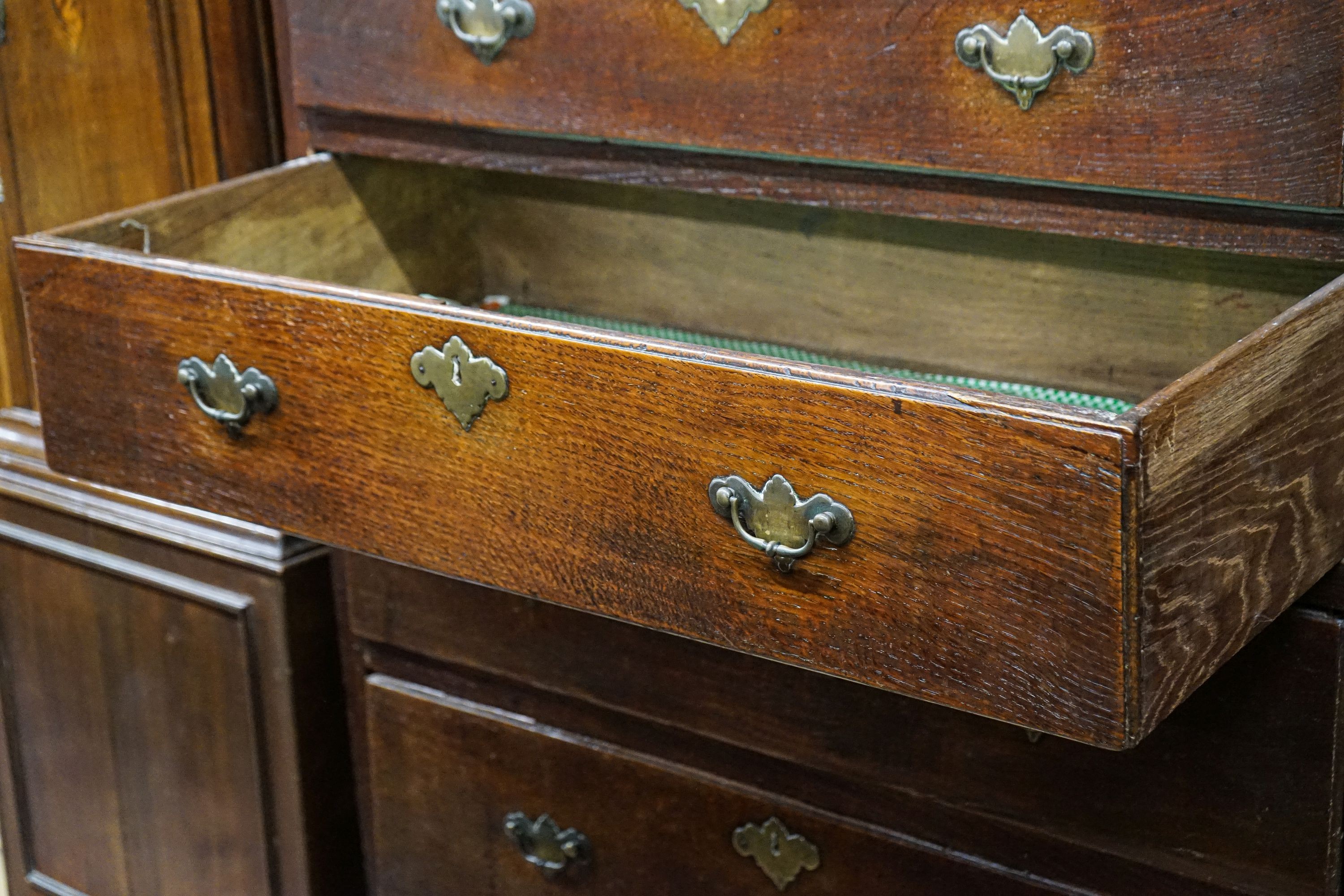 A George III oak chest of two short and four long drawers, on bracket feet, width 102cm, depth 56cm, height 136cm